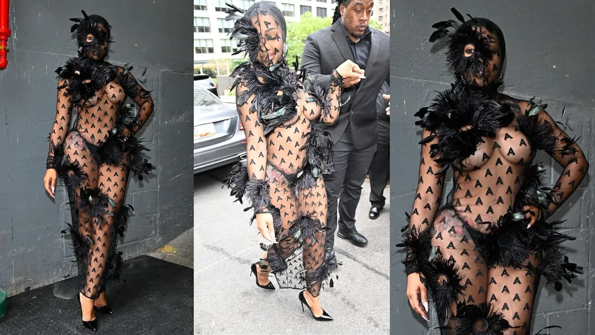 Wearing a see-through mesh dress, Yung Miami poses for photos outside of the Area fashion show