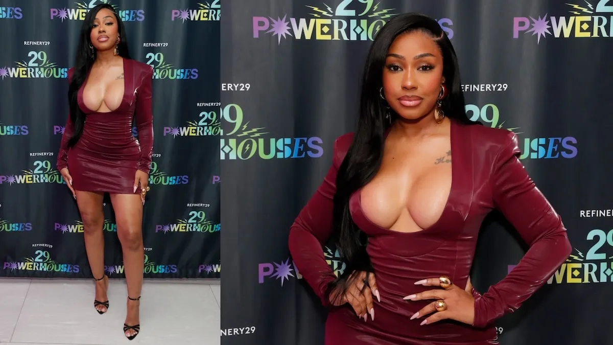 Wearing a burgundy leather mini dress, Yung Miami poses for photos at the Refinery29's Inaugural 29 Powerhouses Celebration