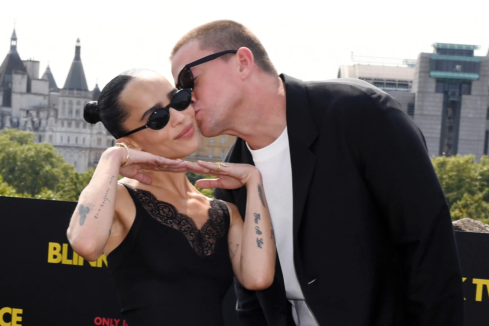 Zoë Kravitz posing with her hands under her chin while Channing Tatum kisses her cheek for 'Blink Twice' photocall