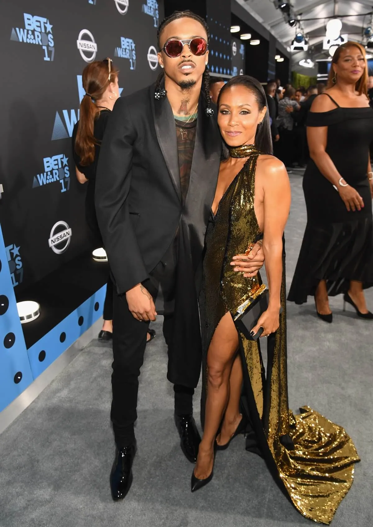 August Alsina posing alongside Jada Pinkett Smith at the BET Hip Hop Awards.