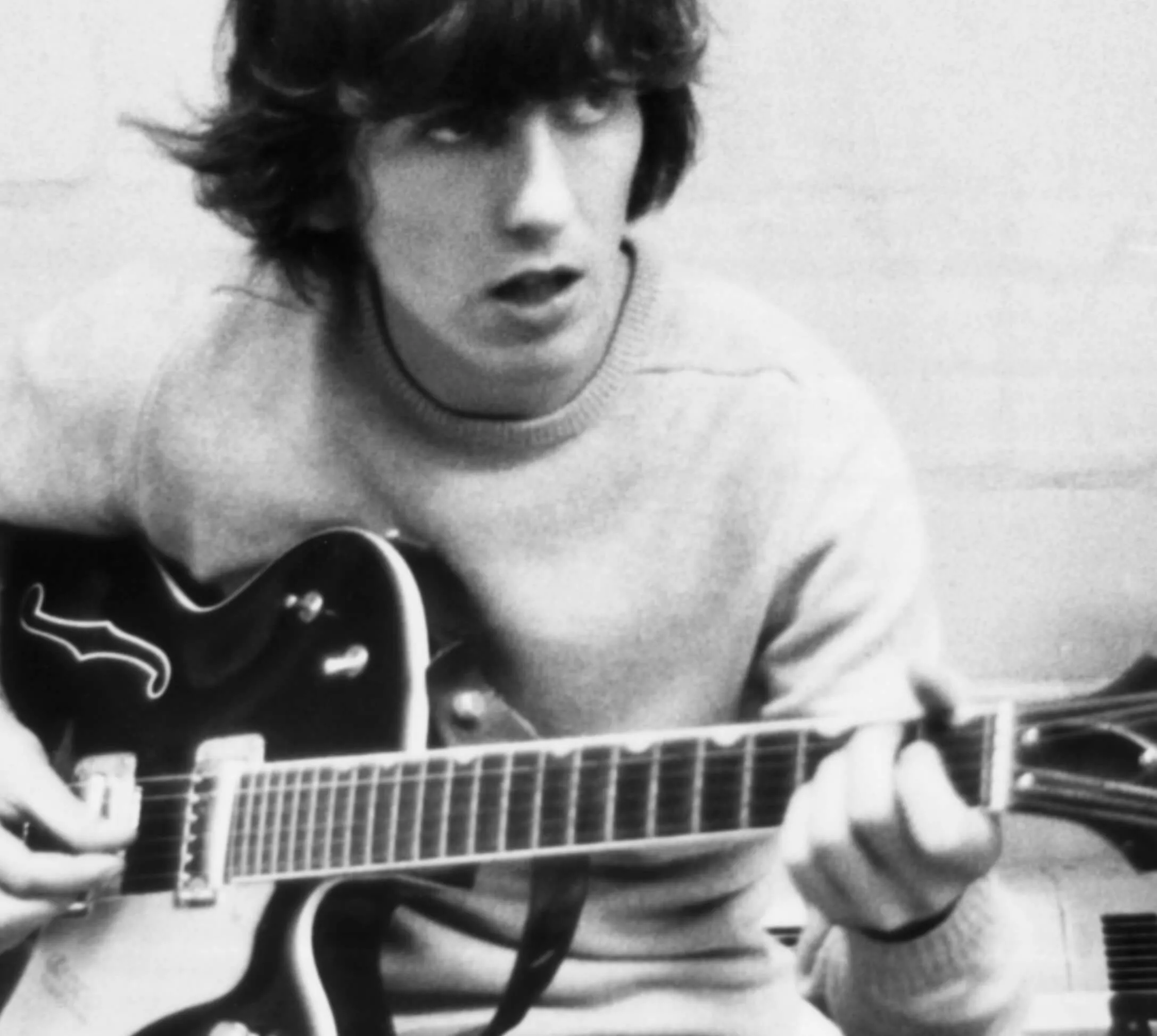 The Beatles' George Harrison with a guitar