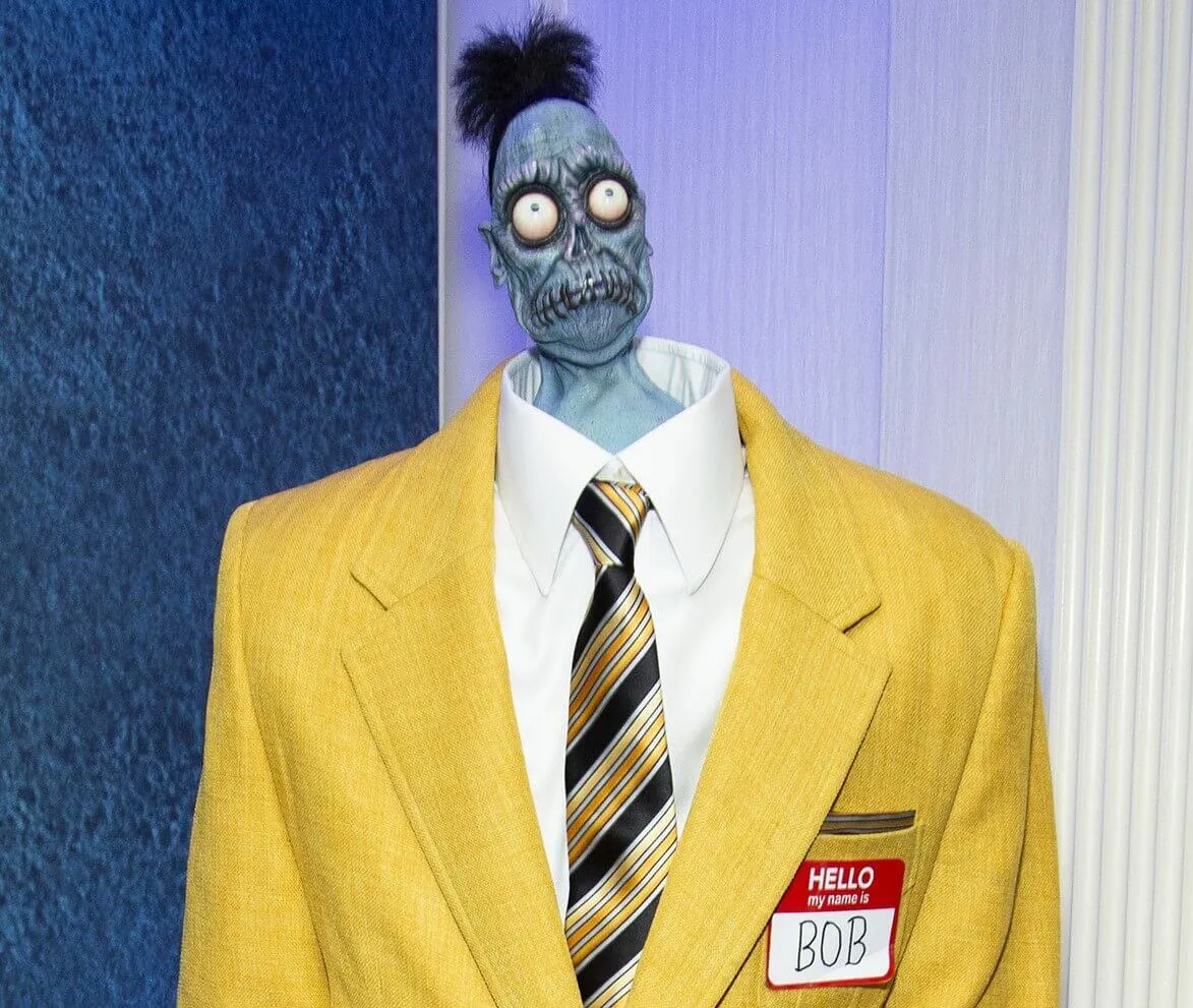 The character Bob from 'Beetlejuice Beetlejuice' in a yellow suit