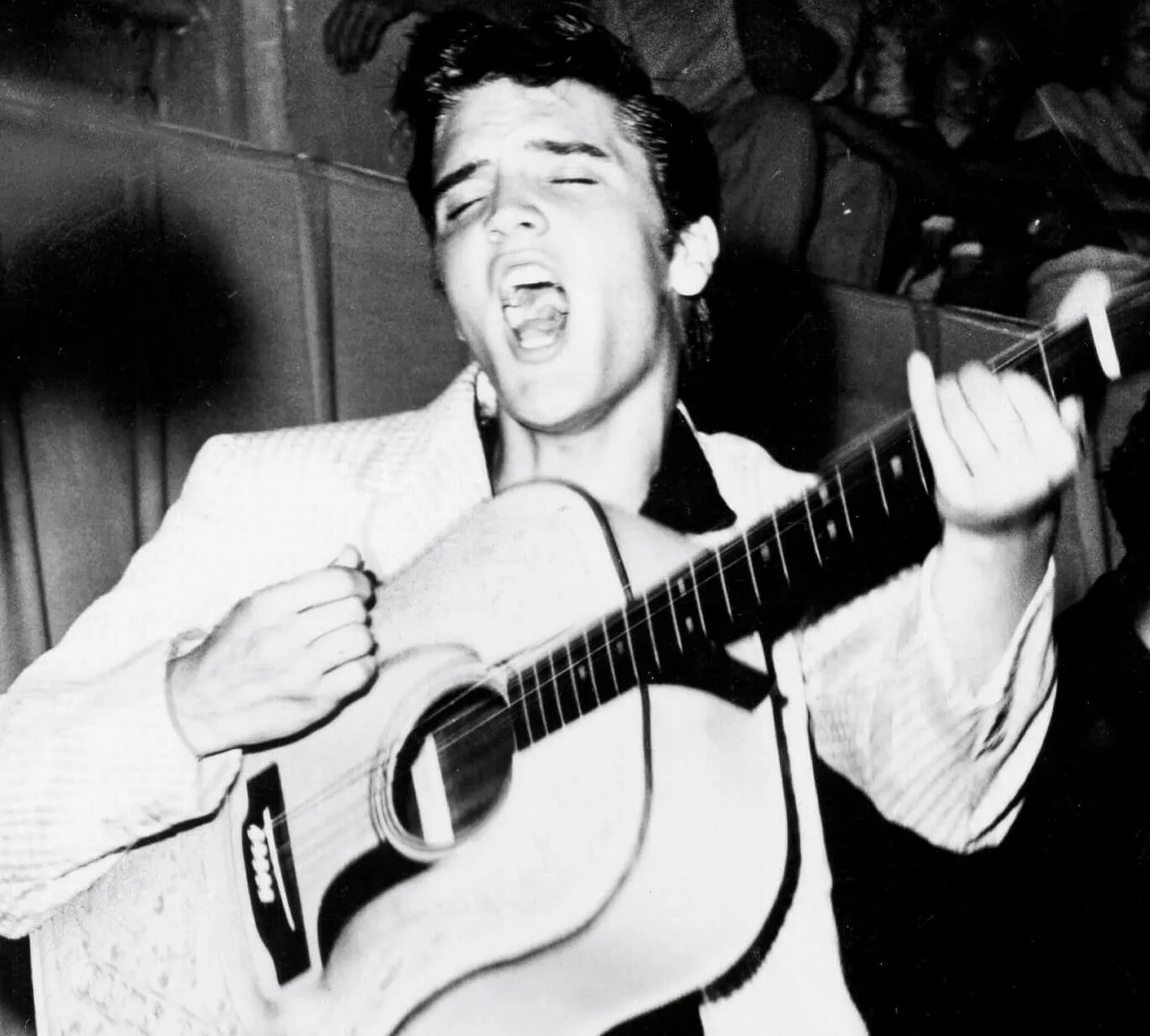 Elvis Presley playing a guitar