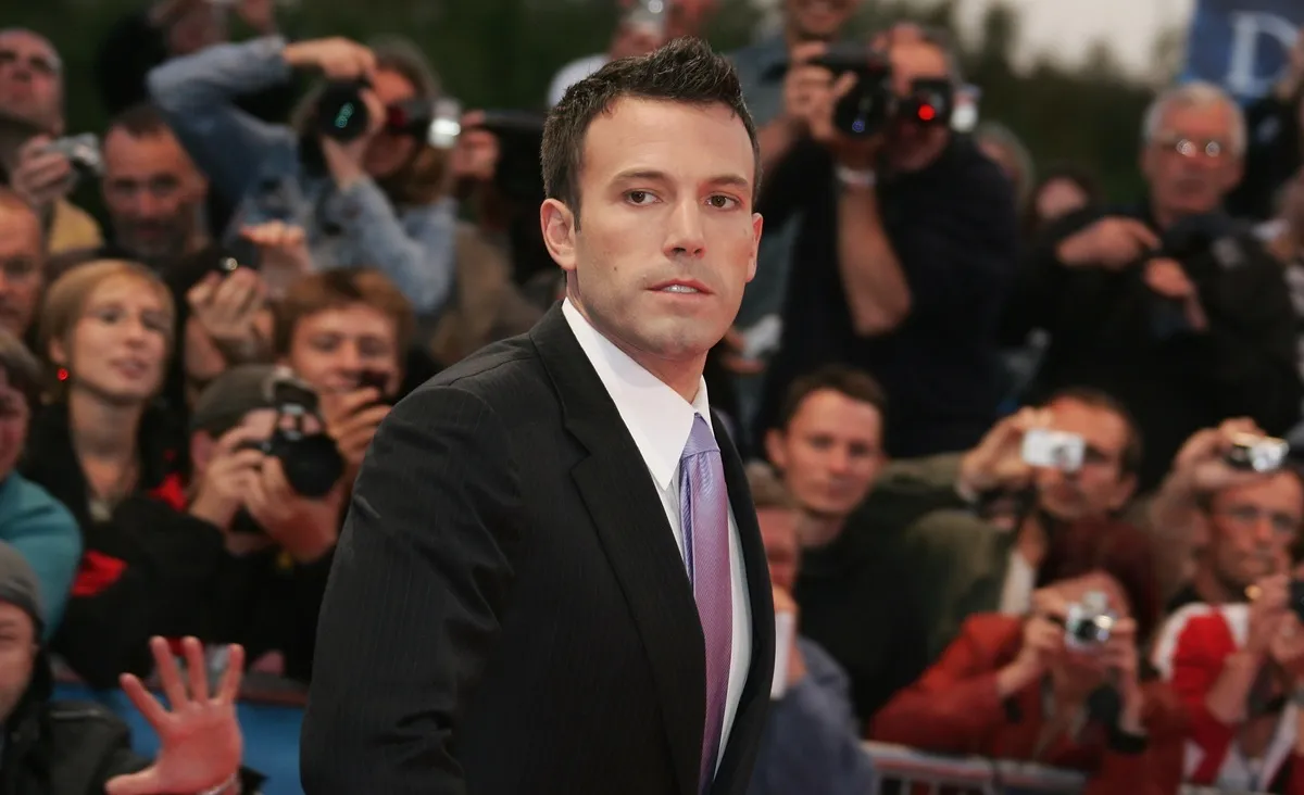 Ben Affleck posing at a film festival for the premiere of 'Gone Baby Gone' while wearing a suit.