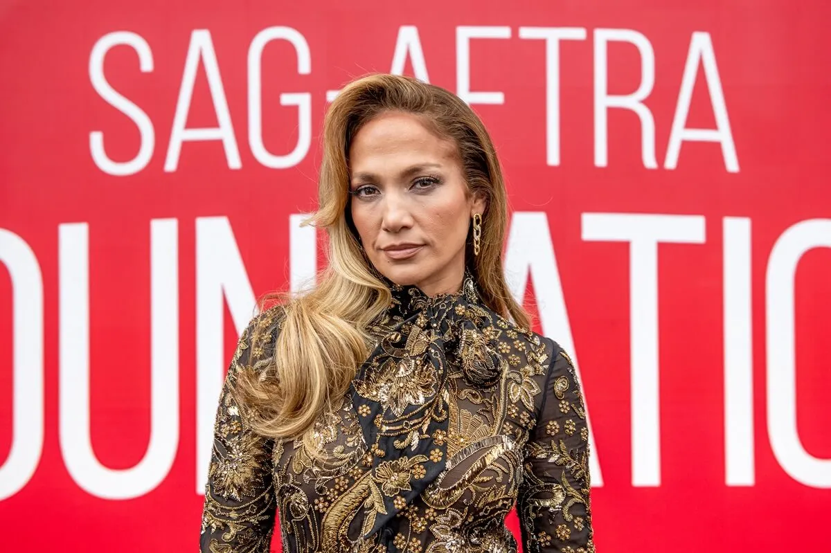 Jennifer Lopez attends SAG-AFTRA Foundation Conversation: "Hustlers" at The Robin Williams Center while wearing a gold dress.