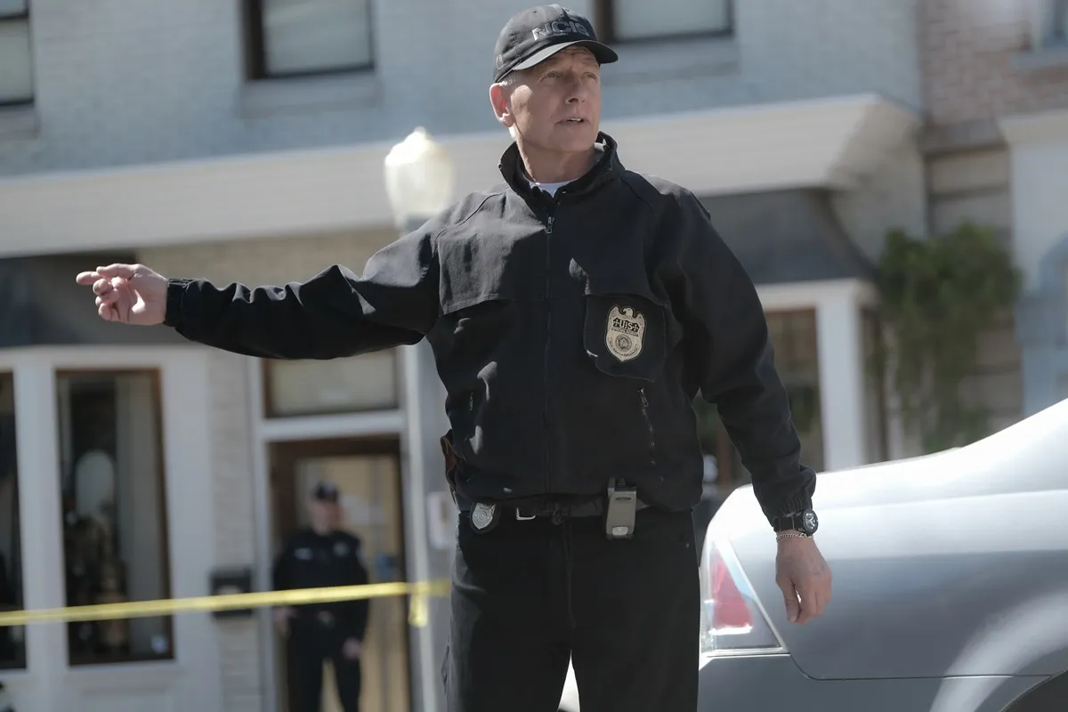 Mark Harmon posing in a police uniform in an episode of 'NCIS'.