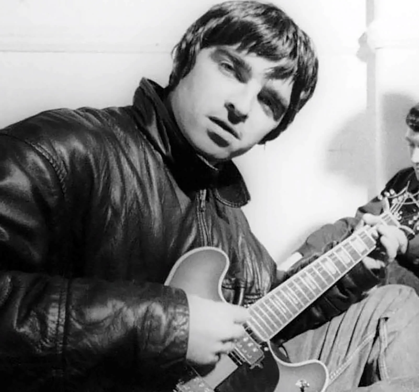 Oasis' Noel Gallagher with a guitar