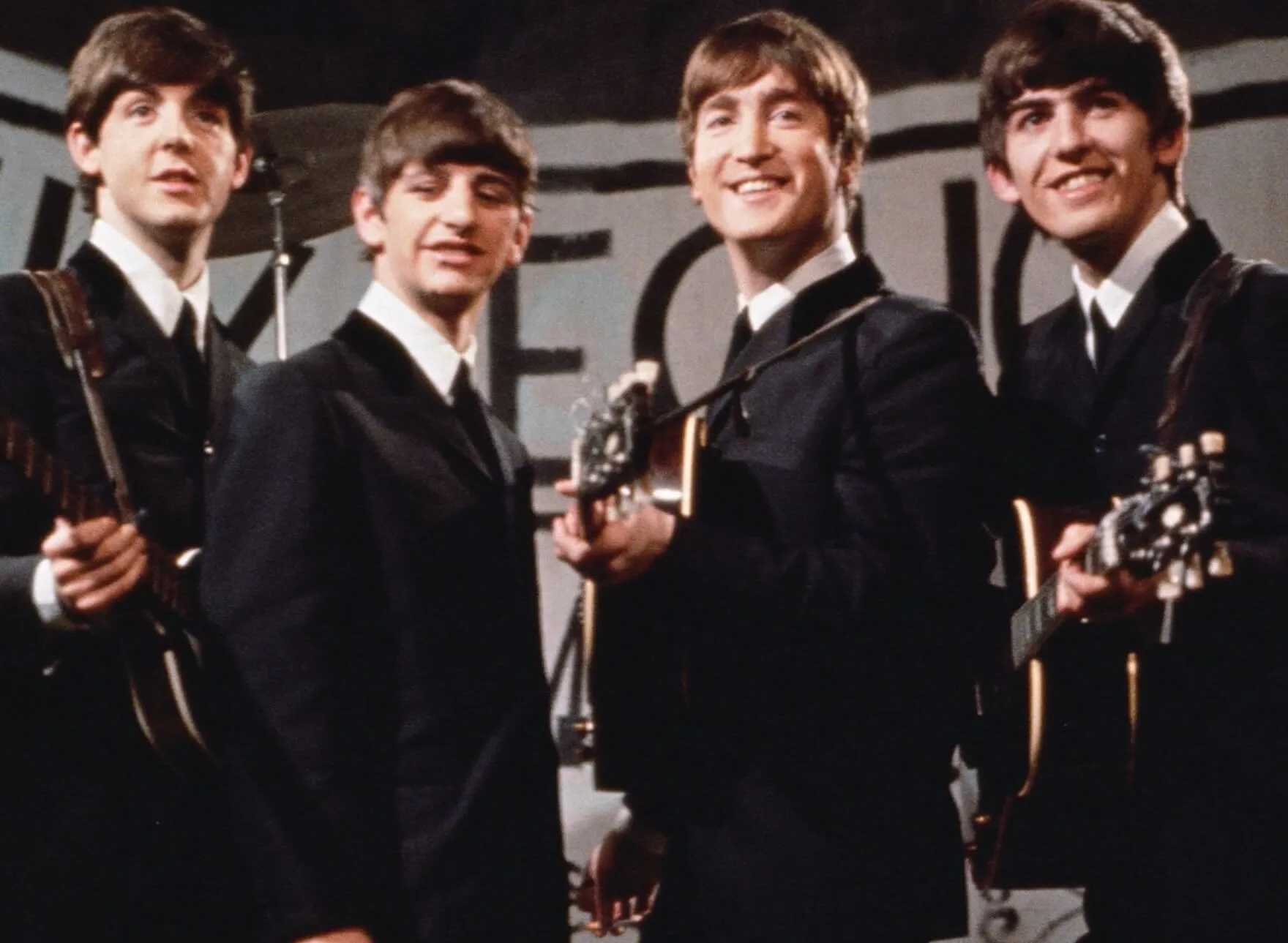 The Beatles wearing black