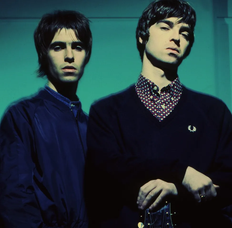 Oasis' Liam and Noel Gallagher standing