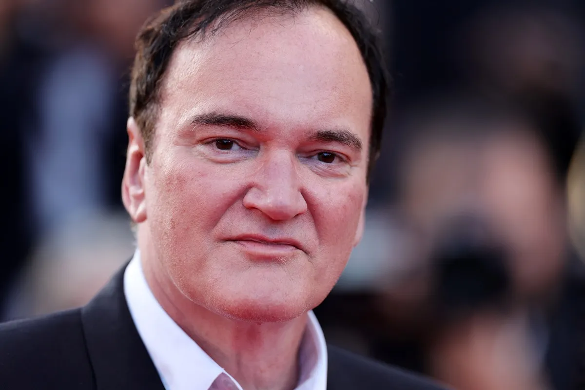 Quentin Tarantino attends the "Elemental" screening and closing ceremony red carpet while wearing a suit.