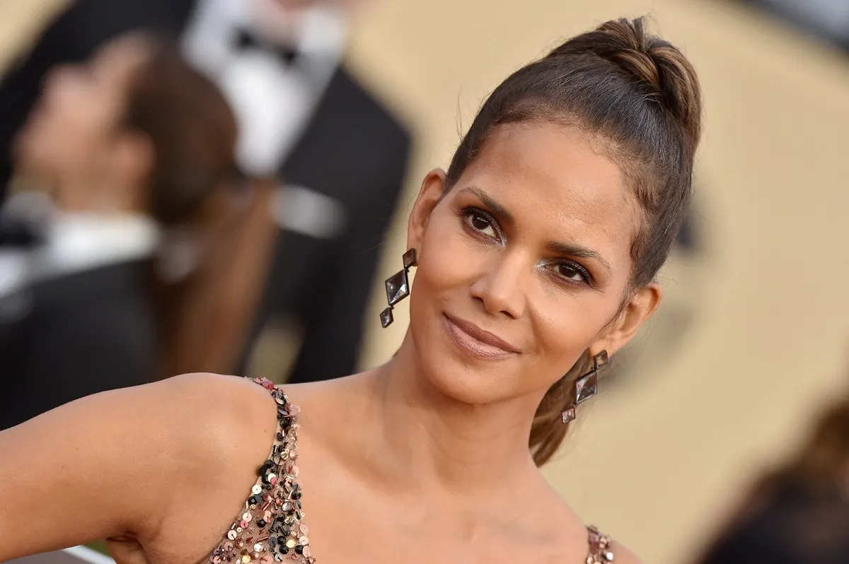 Halle Berry attends the 24th Annual Screen Actors Guild Awards at The Shrine Auditorium in a dark brown dress.