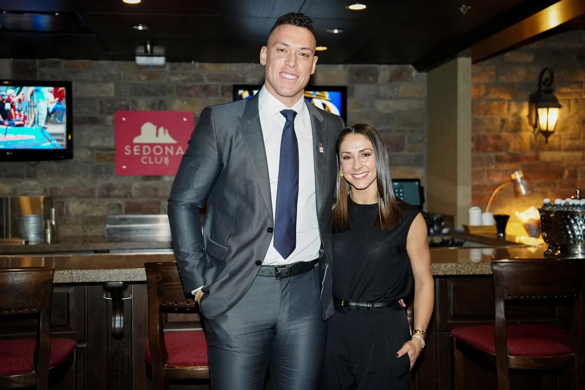 Aaron Judge and his wife, Samantha Bracksieck, pose for a photo during a Make-A-Wish foundation meet and greet