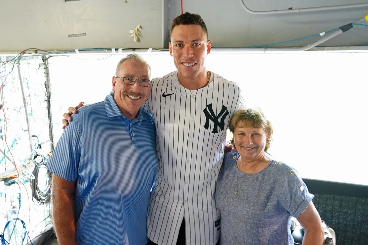 Aaron Judge poses for a photo with his parents during a visit to the Little League International Complex in South Williamsport, Pennsylvania