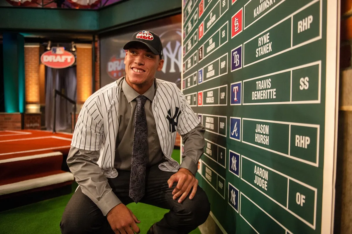 Aaron Judge poses next to the Draft board during the 2013 First-Year Player Draft at MLB Network's Studio 42 on June 6, 2013 in Secaucus, New Jersey