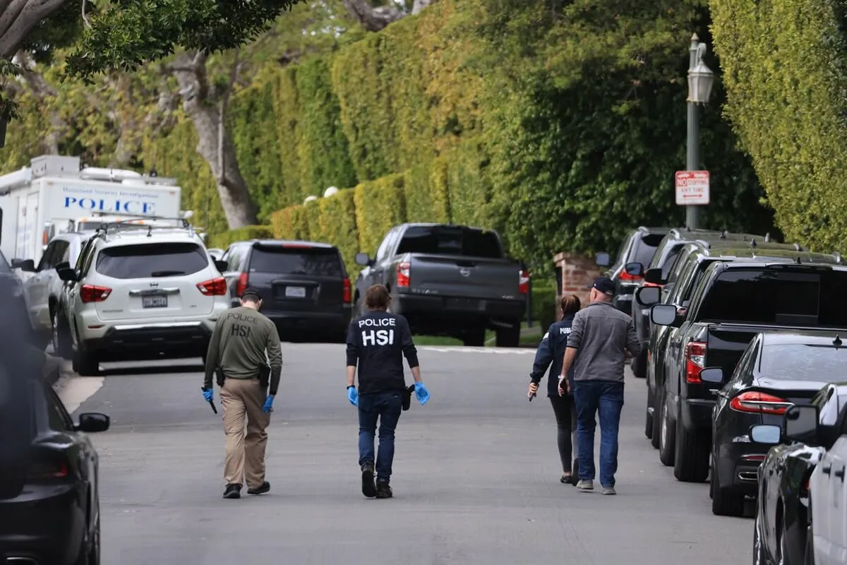 Officers are seen outside Sean "Diddy" Combs' home in Los Angeles