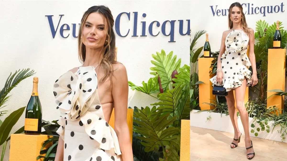 Wearing a white and black polka dot mini dress, Alessandra Ambrosio smiles at the Veuve Clicquot Polo Classic