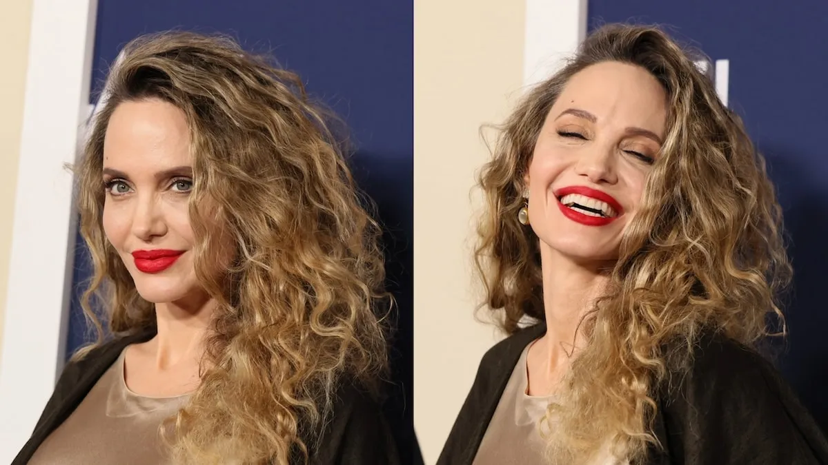 Wearing red lipstick and a curly hairstyle, Angelina Jolie smiles broadly at the 'Maria' screening at AFI Fest