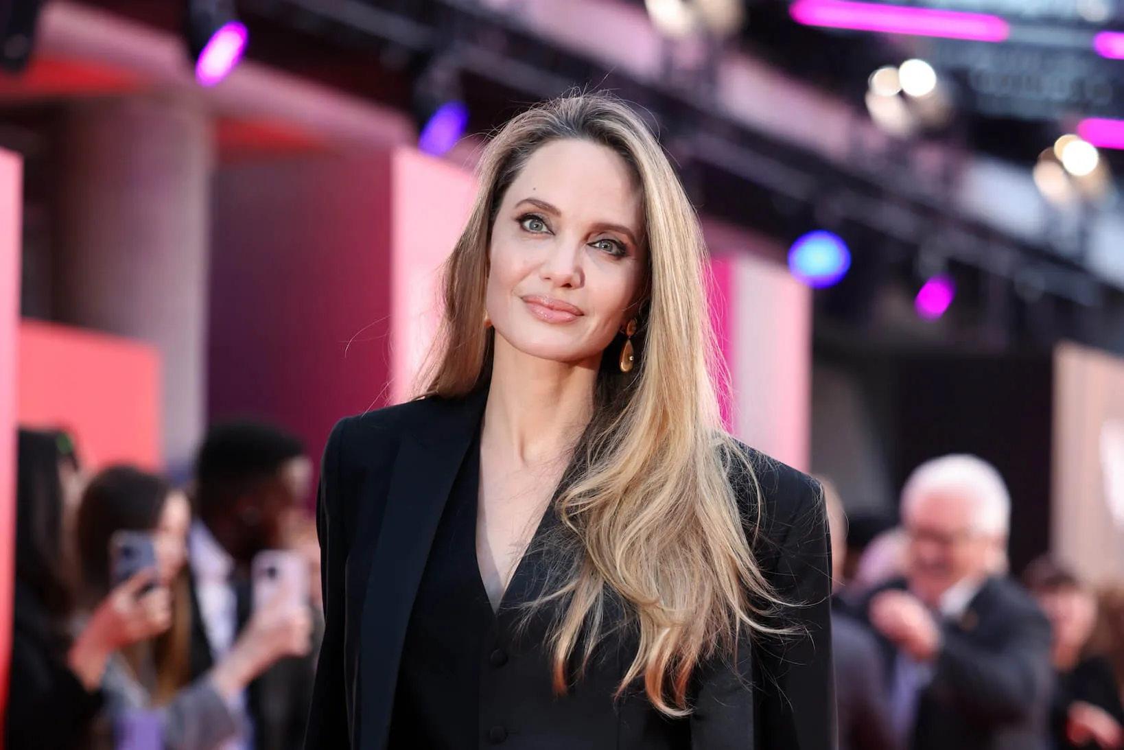 A close-up of Angelina Jolie wearing a black suit at the 'Maria' Headline Gala during the 68th BFI London Film Festival