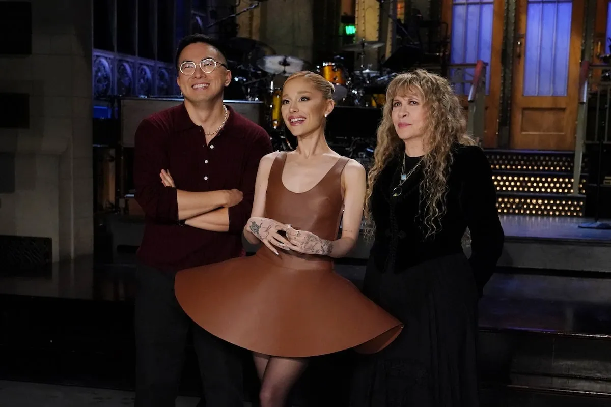 'SNL' cast member Bowen Yang, host Ariana Grande, and musical guest Stevie Nicks smile while filming 'Saturday Night Live' promos