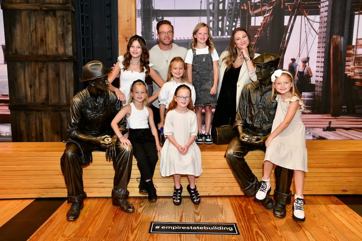 The Busby family from 'OutDaughtered' pose for a photo at the Empire State building