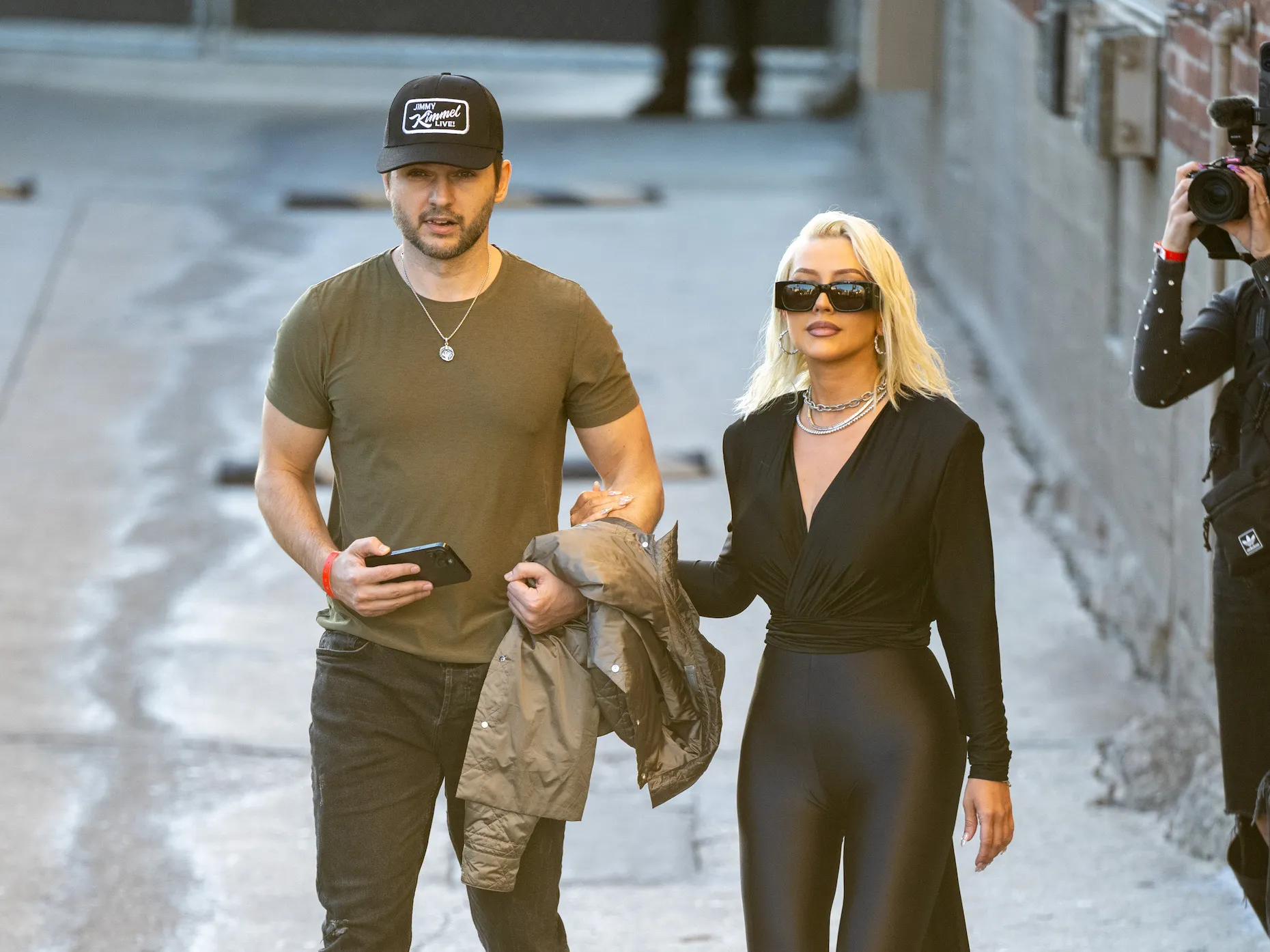 Matthew Rutler and Christina Aguilera standing together on the street in Los Angeles