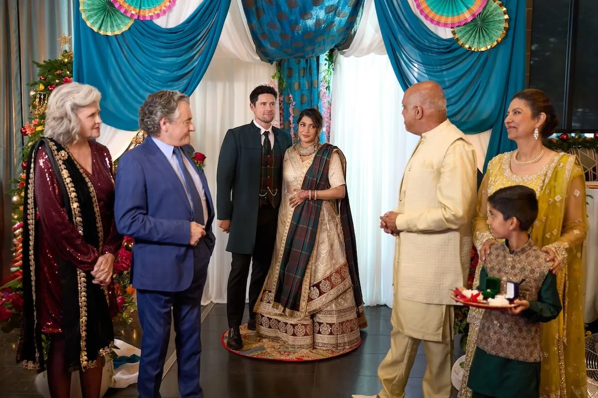 A man and a woman in Indian-style dress in the Hallmark movie 'Christmas With the Singhs'