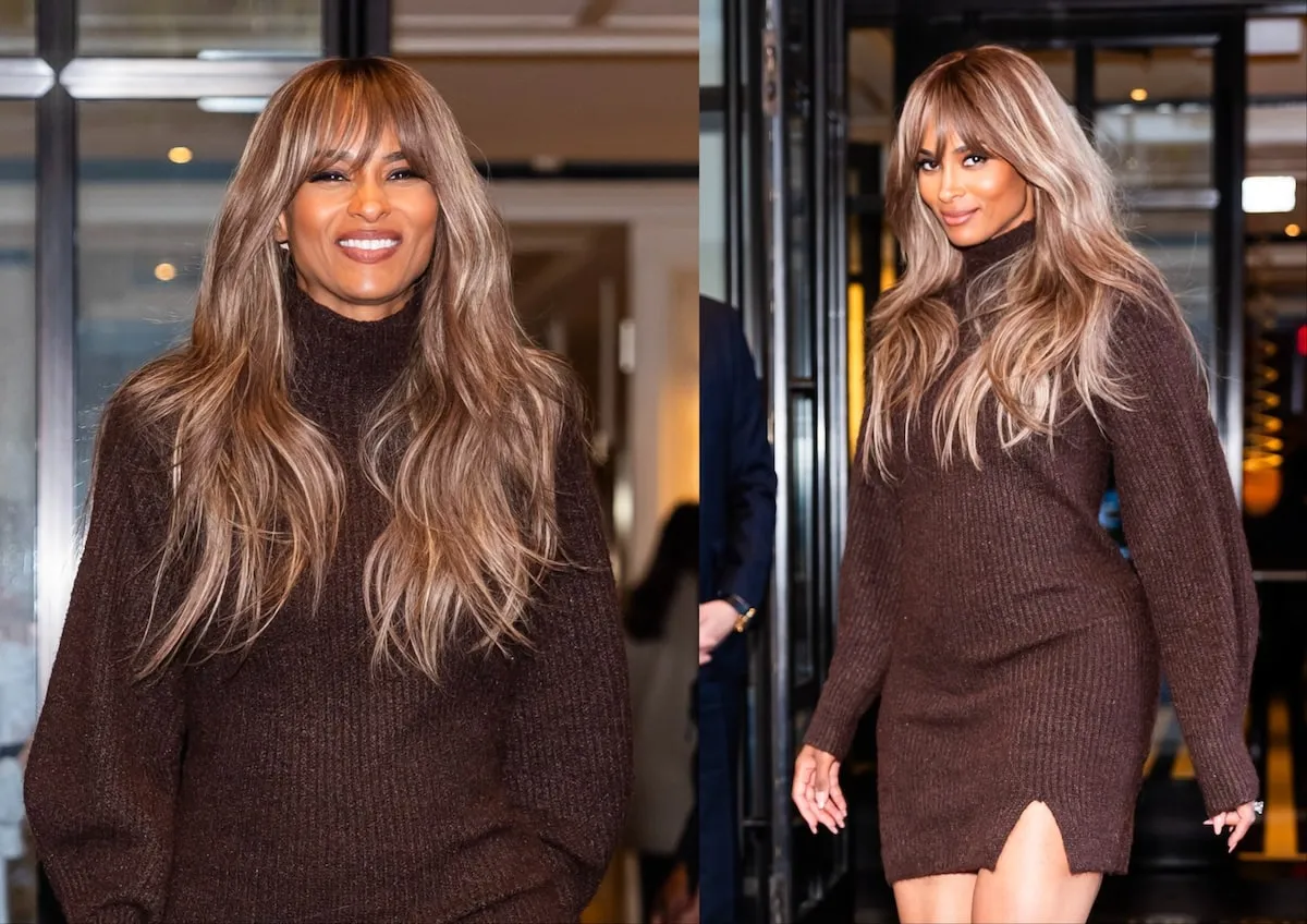 Singer Ciara wears a chocolate brown sweater dress and smiles at the camera as she walks down an NYC street