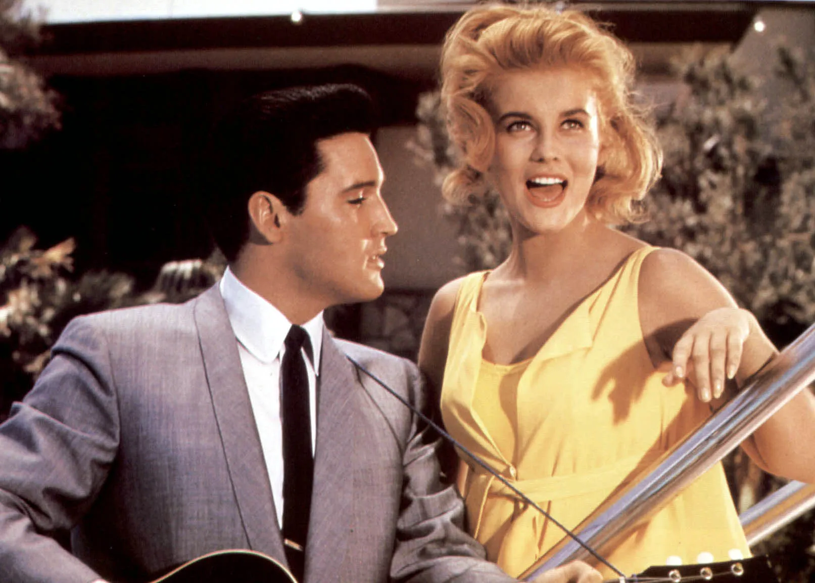 Elvis, in a gray suit, and Ann-Margret, in a yellow dress, in 'Viva Las Vegas'