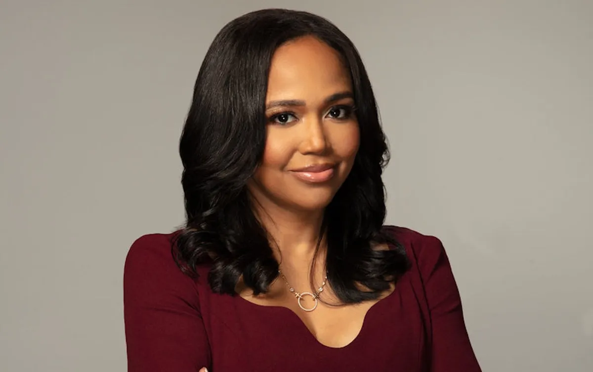 Portrait of Faith Jenkins in a plum-colored dress