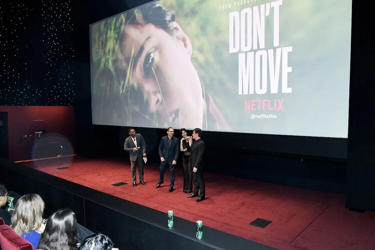 Don't Move's Brian Netto, Adam Schindler, Kelsey Asbille, and Finn Wittrock speak onstage during the Netflix Special Screening