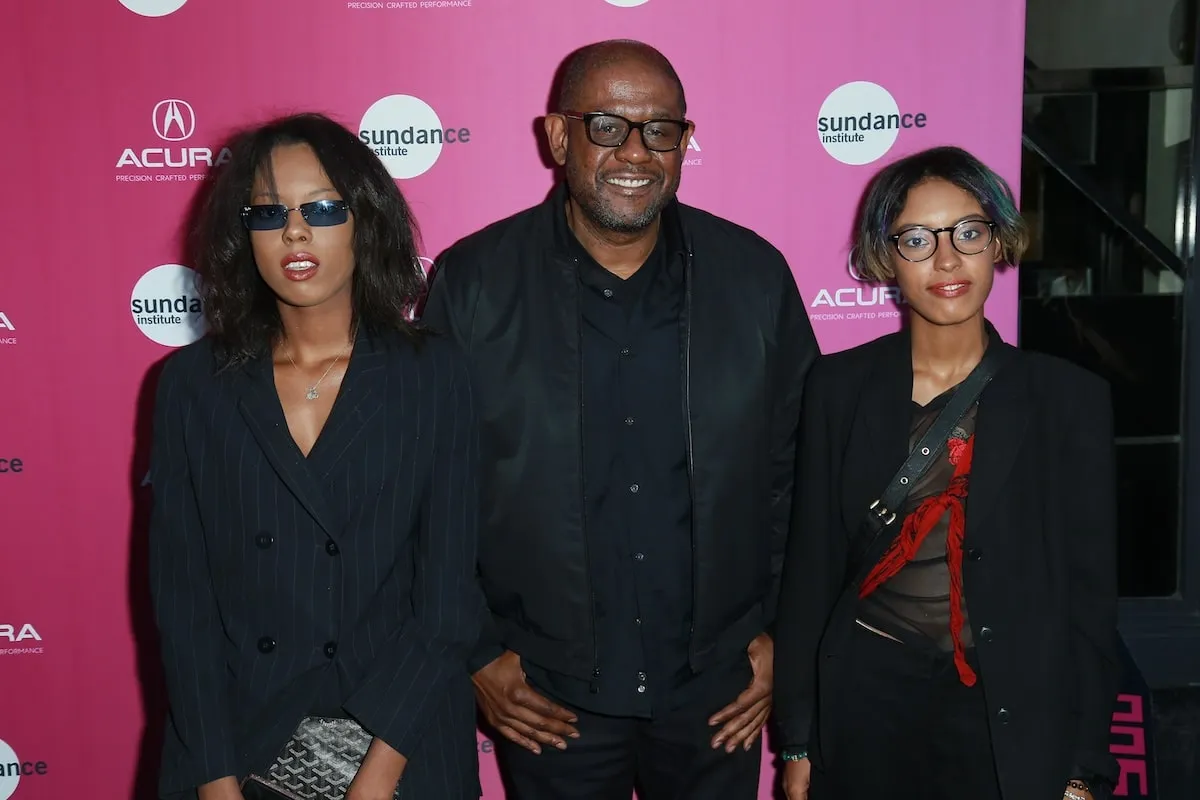 Actor Forest Whitaker stands with two of his daughters, True and Autumn, at a media event in 2018