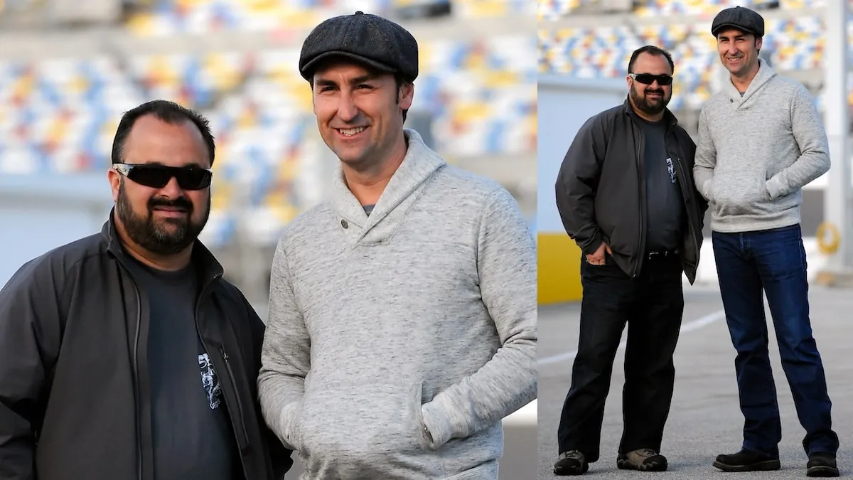 American Pickers stars Frank Fritz and Mike Wolfe stand on the racetrack at Daytona International Speedway