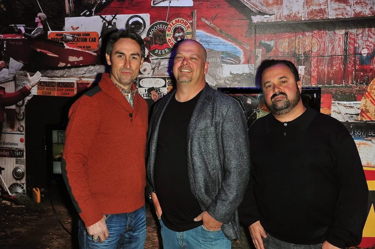 Pawn Stars' Rick Harrison stands between American Pickers' stars Mike Wolfe and Frank Fritz in 2010