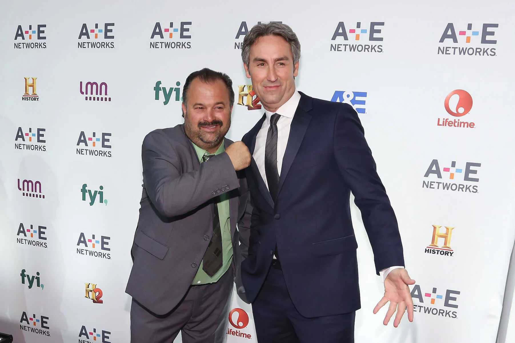 'American Pickers' stars Frank Fritz and Mike Wolfe dressed in suits and posing with each other