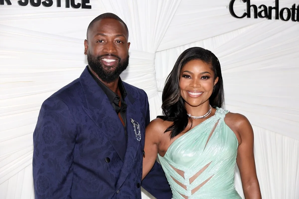 Gabrielle Union posing alongside Dwyane Wade at the Clooney Foundation for Justice's The Albies at New York Public Library.