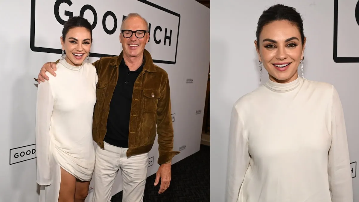 Wearing a white dress, Mila Kunis smiles as she stands with Michael Keaton on the red carpet for 'Goodrich'