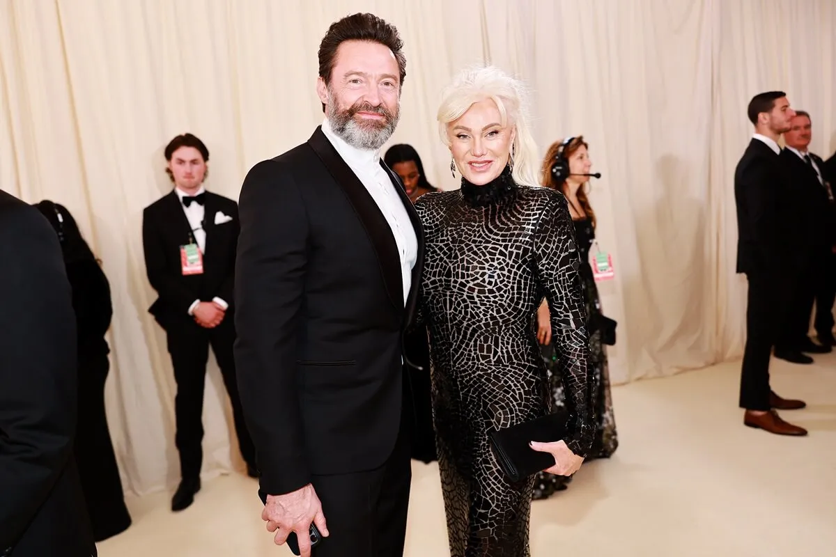 Hugh Jackman Deborra-Lee Furness attend The 2023 Met Gala wearing a suit and black dress.