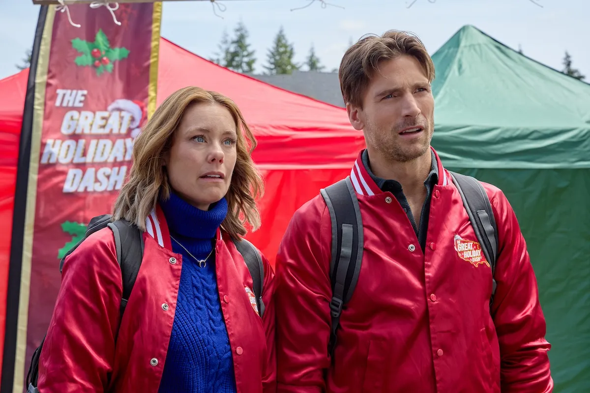 Woman and man wearing shiny red bomber jackets