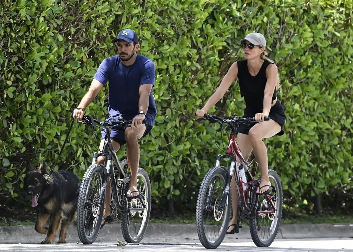 Joaquim Valente and Gisele Bündchen are seen on a bike ride in Surfside, Florida