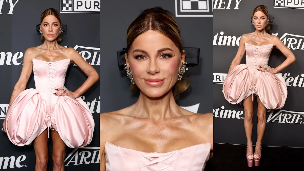 Wearing a pink dress and tall pink heels, Kate Beckinsale poses for cameras at the Power of Women event