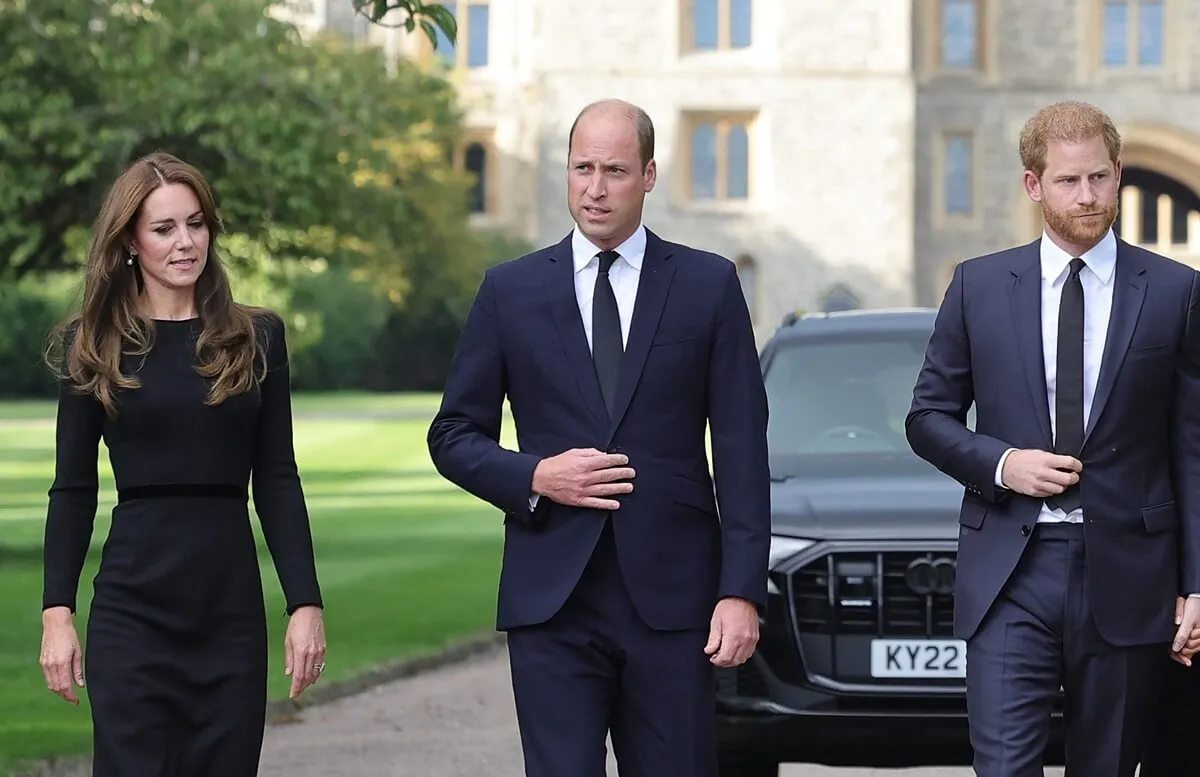 Kate Middleton, Prince William, and Prince Harry arrive on the long Walk at Windsor Castle to view flowers and tributes to Queen Elizabeth II