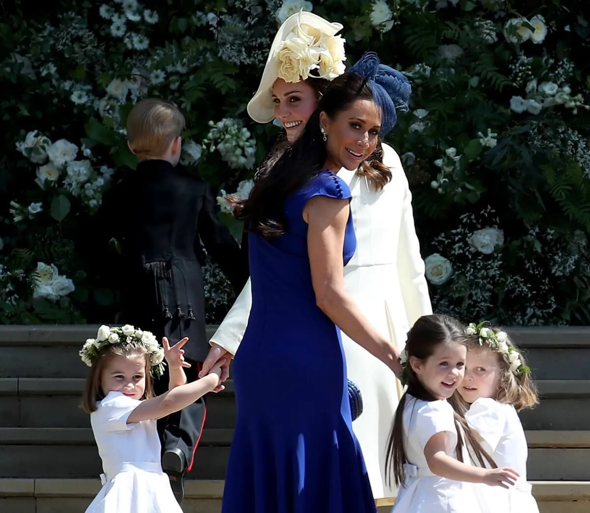 Kate Middleton, Princess Charlotte, and other bridesmaids arrive at St. George's Chapel for the wedding of Prince Harry and Meghan Markle