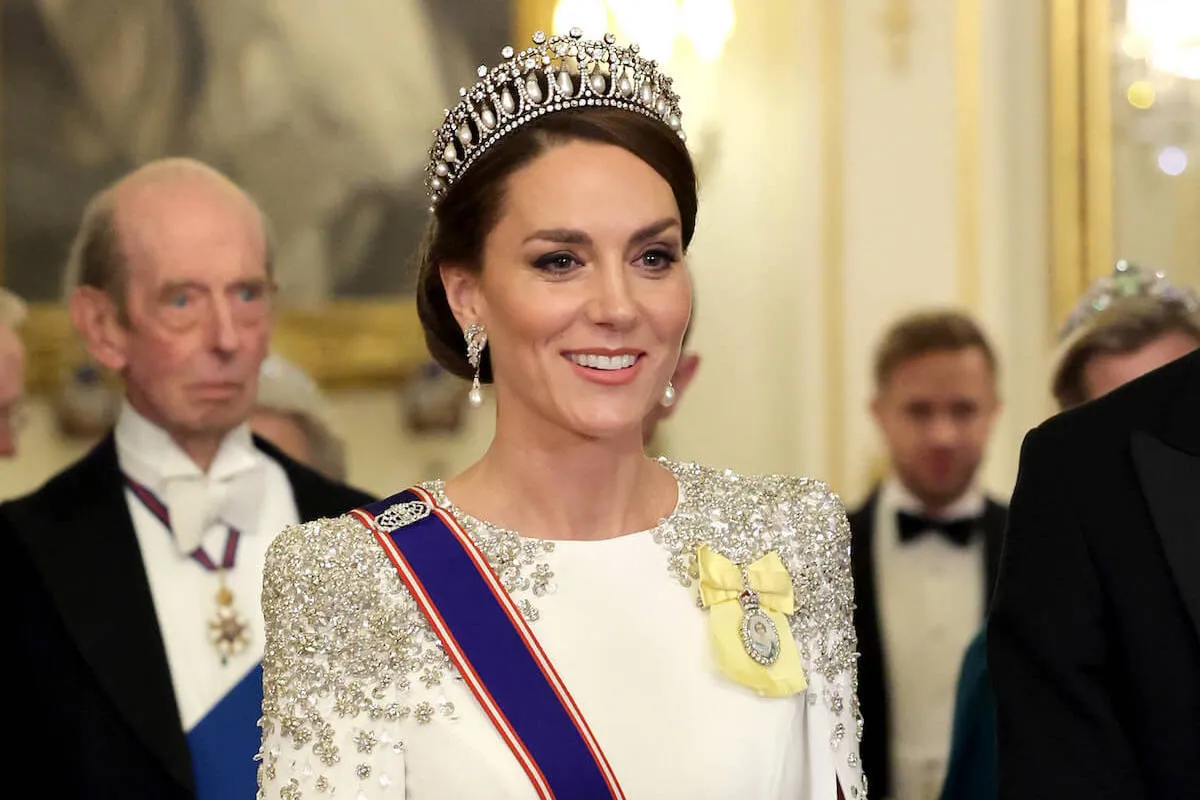 Kate Middleton, who may attend a state dinner and wear a tiara in December 2024, smiles wearing a tiara