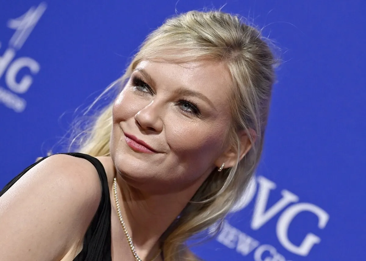 Kirsten Dunst attends the 2024 Palm Springs International Film Festival Film Awards while wearing a black dress.