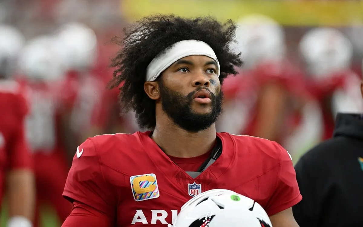 Kyler Murray of the Arizona Cardinals looks up at the scoreboard against the Washington Commanders at State Farm Stadium