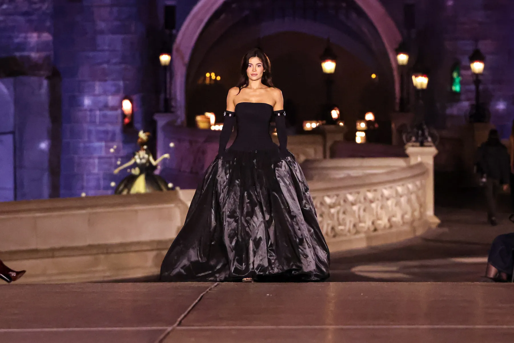 Kylie Jenner in a long black gown walking the runway during the Coperni Paris Womenswear Spring-Summer 2025 show as part of Paris Fashion Week at Disneyland Paris on Oct. 1, 2024