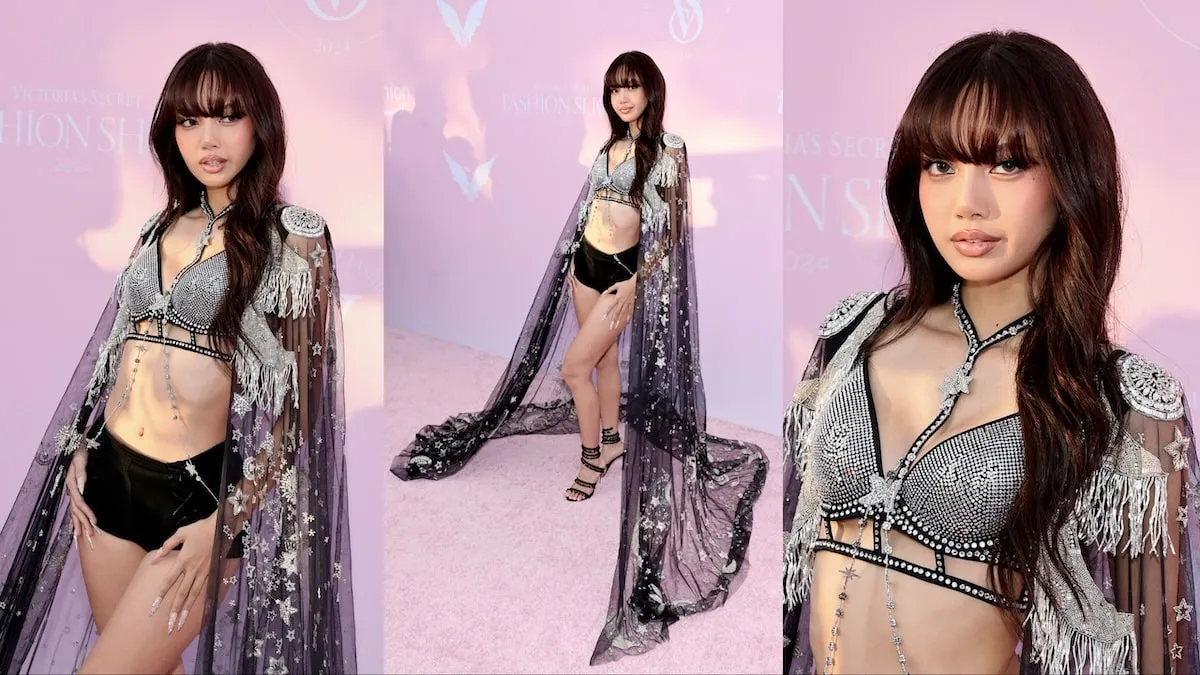 Wearing a black and silver bedazzled cape, bra, and panties, LISA walks the pink carpet before the Victoria's Secret runway show