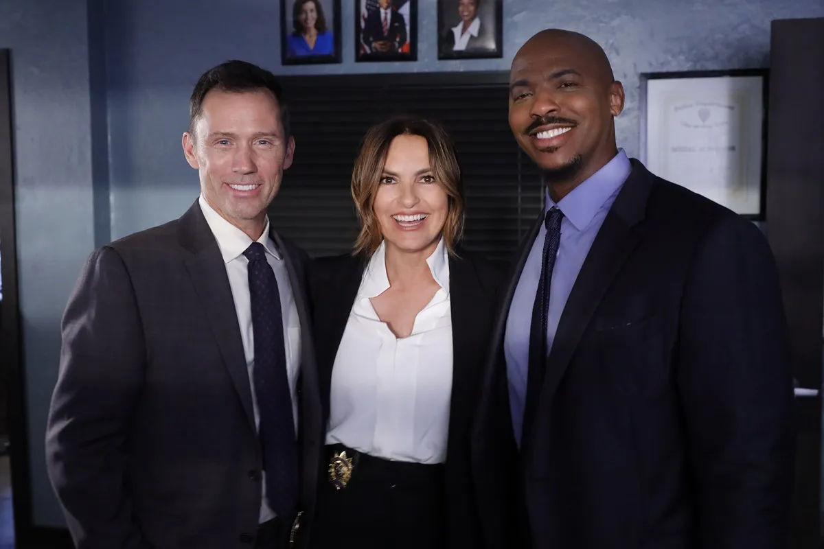 Mariska Hargitay posing between Jeffrey Donovan and Mehcad Brooks on the set of 'Law & Order'.