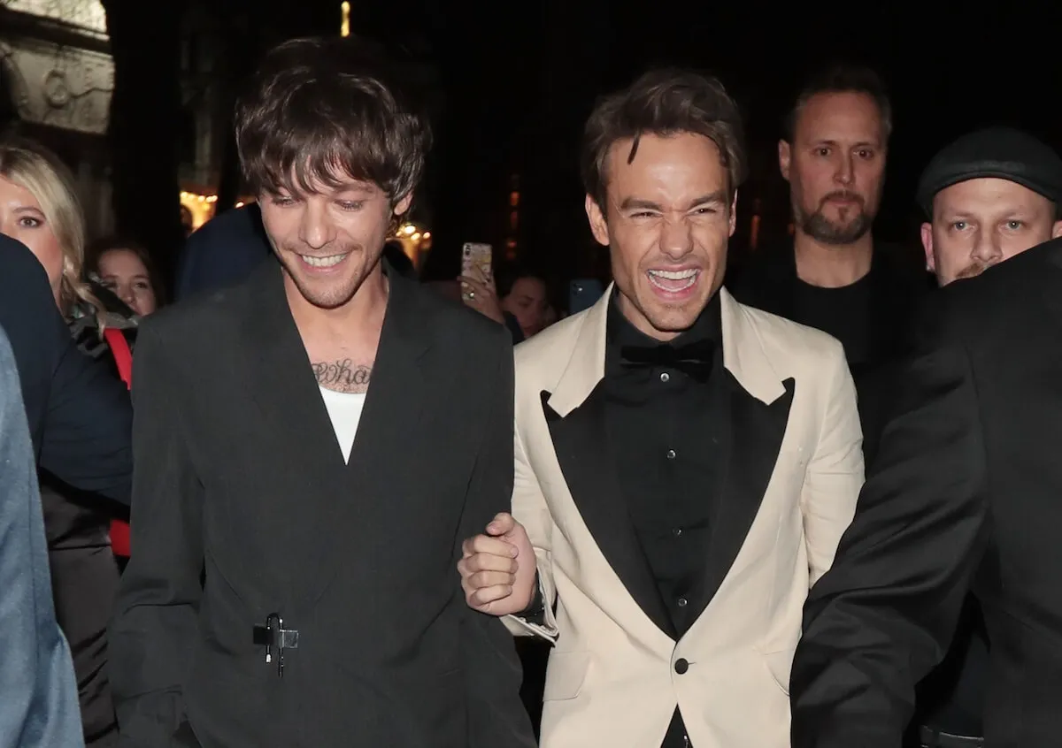 Liam Payne (right) laughs with former One Direction bandmate Louis Tomlinson in 2023