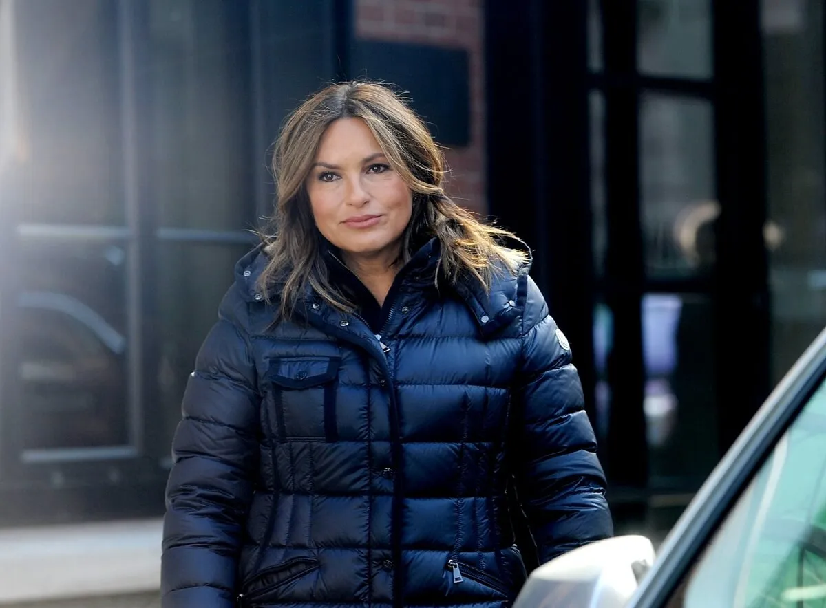 Mariska Hargitay posing in a black coat on the set of 'Law & Order SVU'.